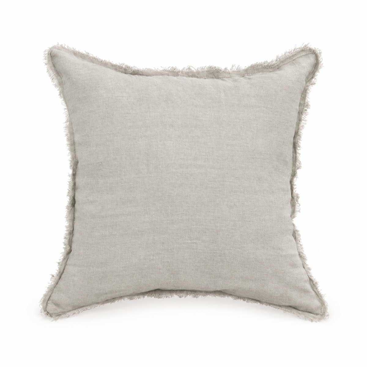 Light stone grey raw linen pillow cover with fringe edges on a warm white background