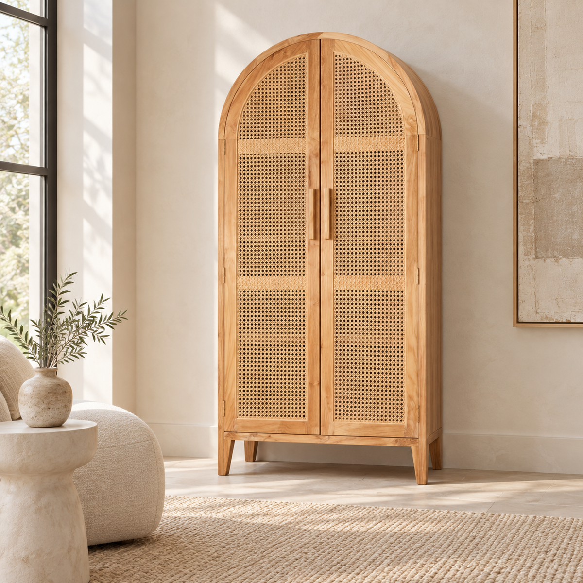 Oslo arched teakwood cabinet with handwoven rattan doors and three interior storage shelves.