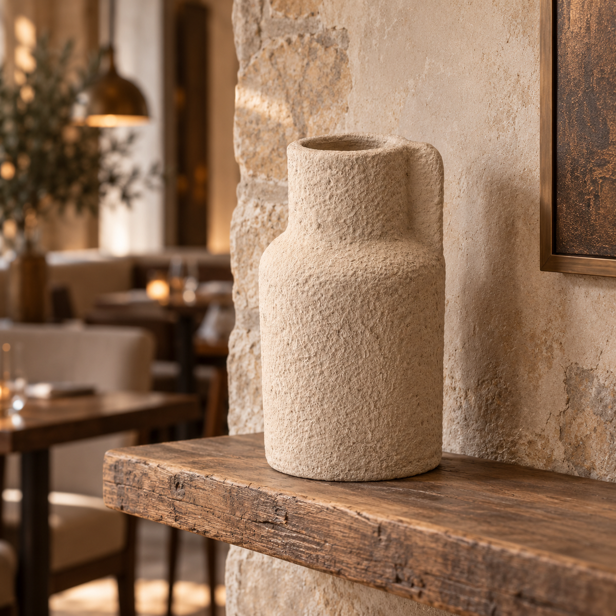 Safa handcrafted textured clay vase in a warm neutral finish with an asymmetric sculptural detail