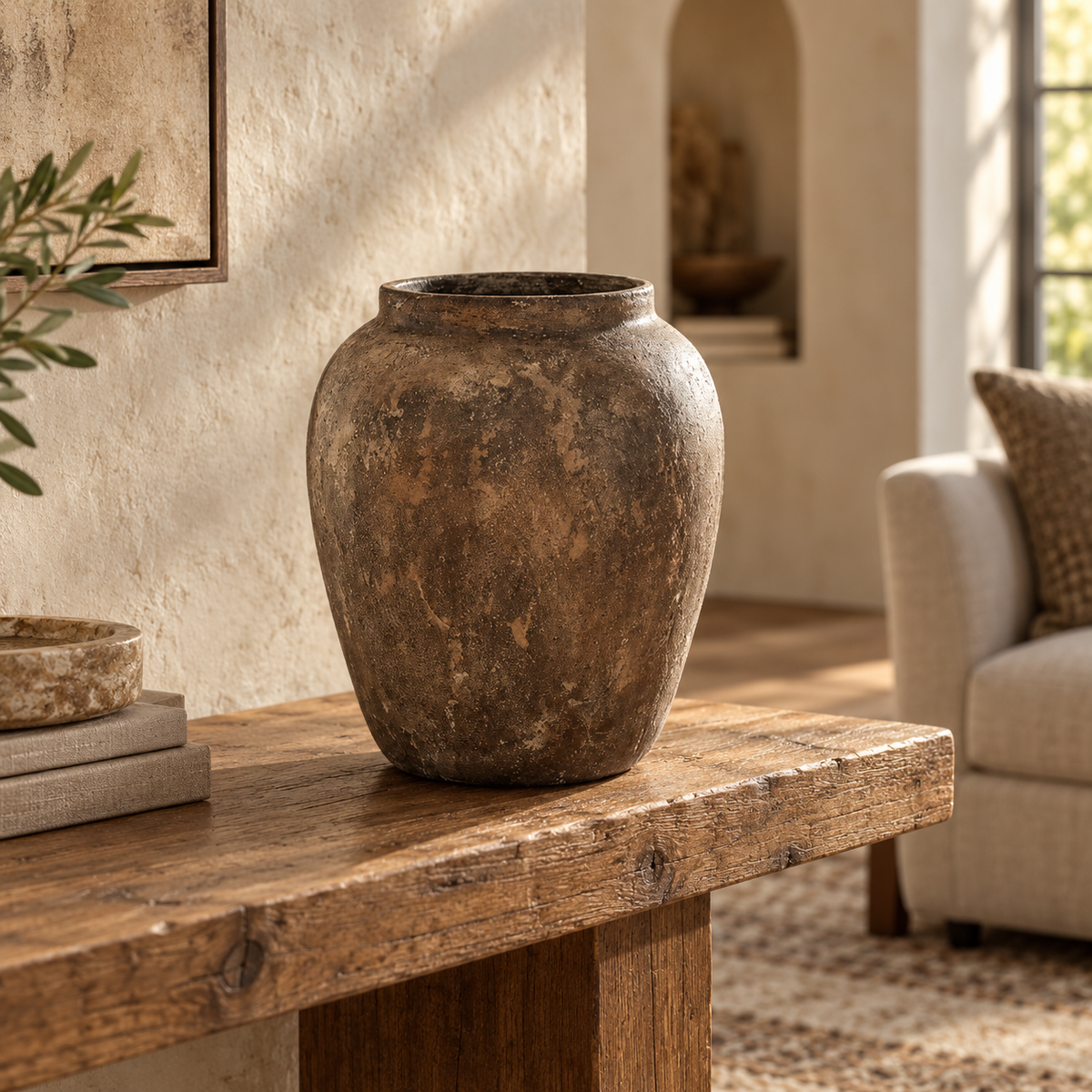 Zoe handcrafted clay vase with a rounded silhouette and distressed brown antique-style patina